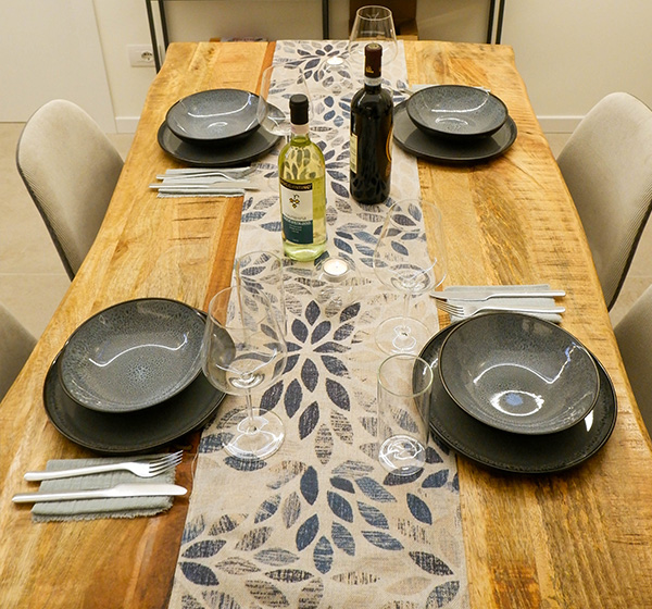 Dining table set for dinner